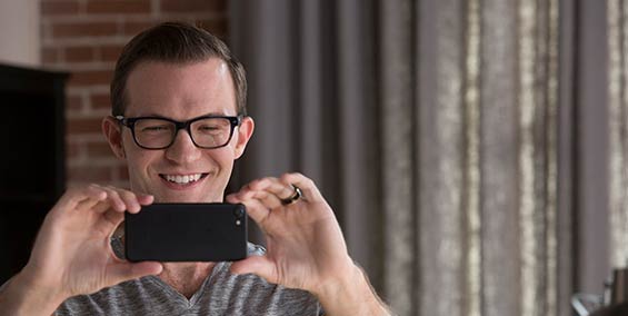 Man video chatting on mobile phone to get moving quote