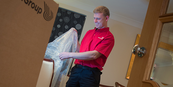 International Moving Worker Packing Belongings